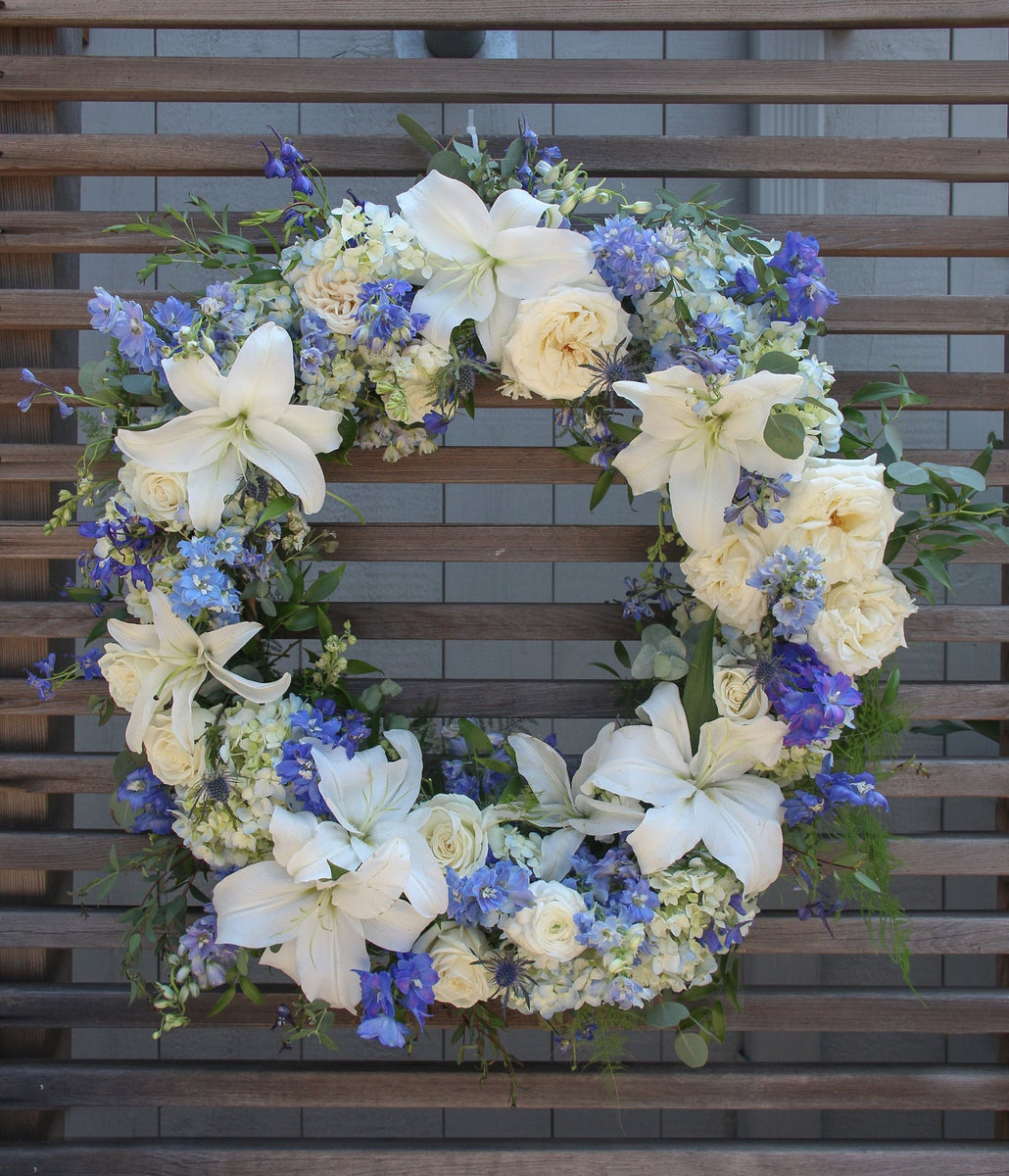 Blue & White Funeral Flower Wreath by Everyday Flowers